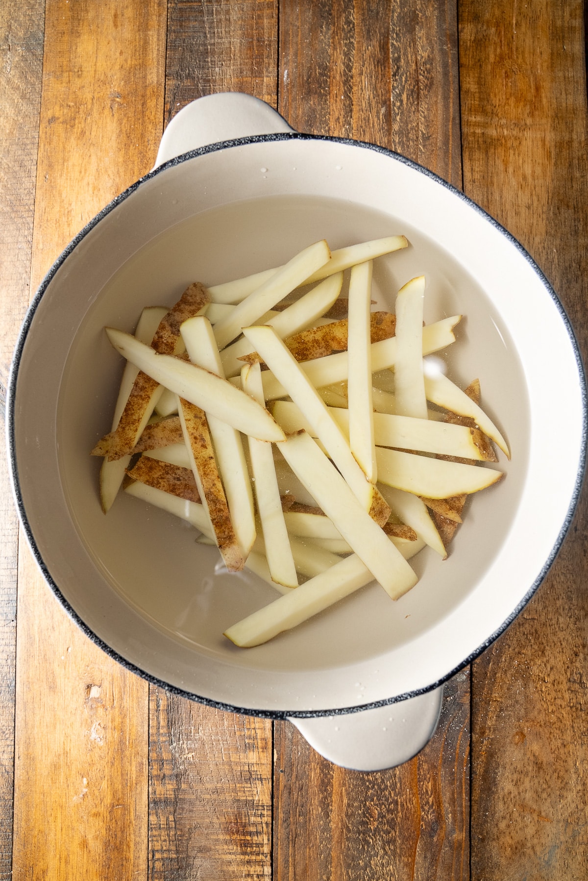 cut potatoes soaking in water