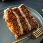 slie of carrot cake with fork on side