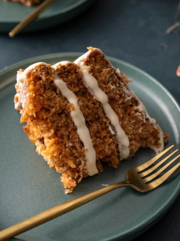 slie of carrot cake with fork on side