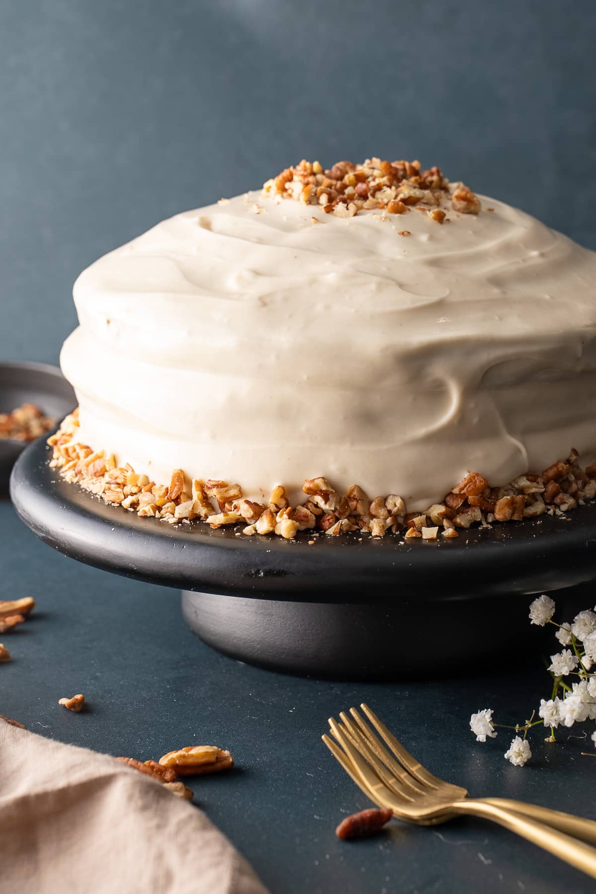 carrot cake frosted on cake platter