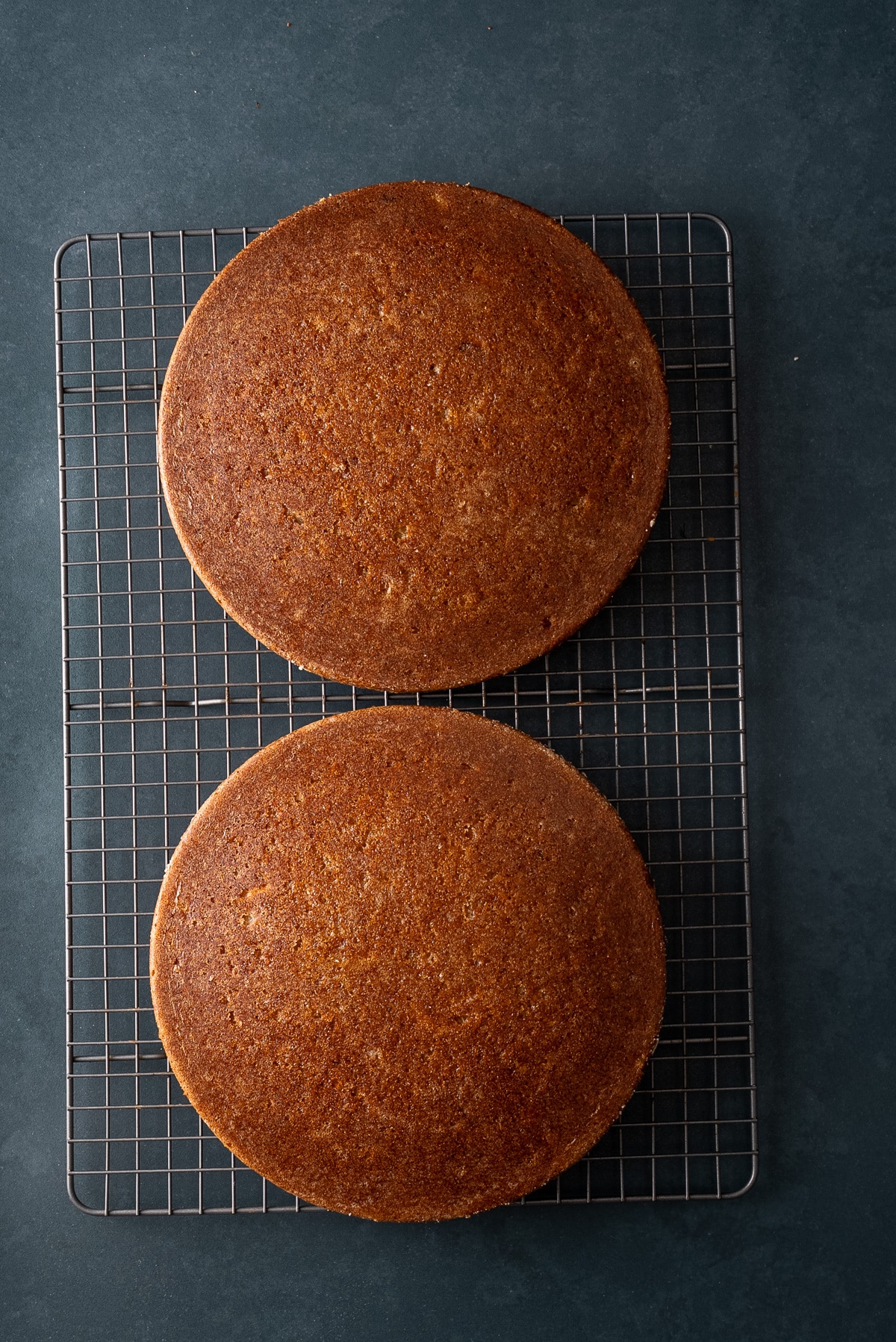 baked carrot cakes cooling on rack