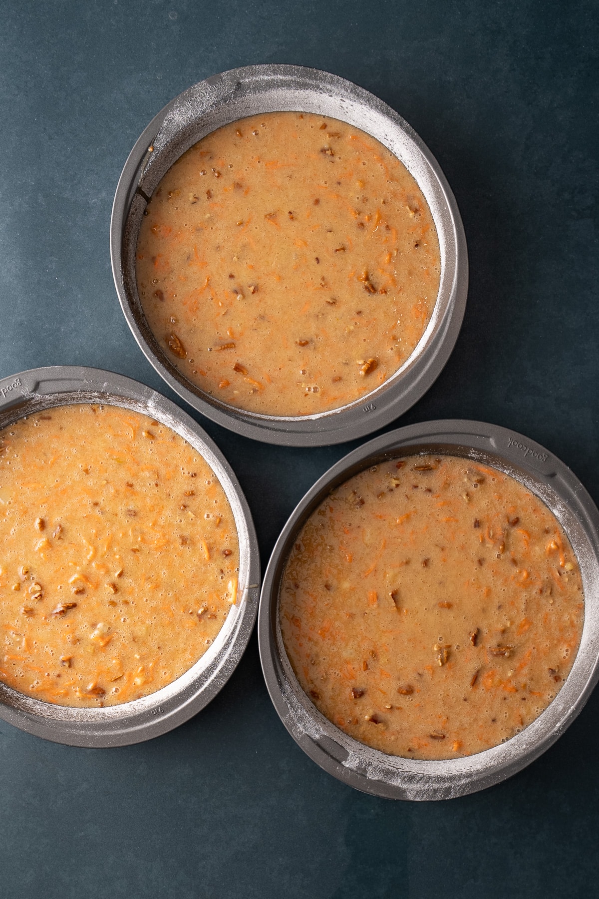 carrot cake batter in baking pans