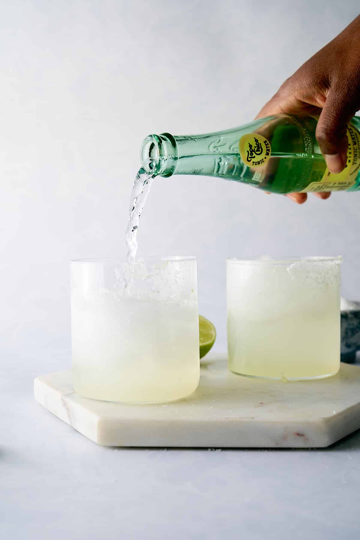 topo chico being poured into glass